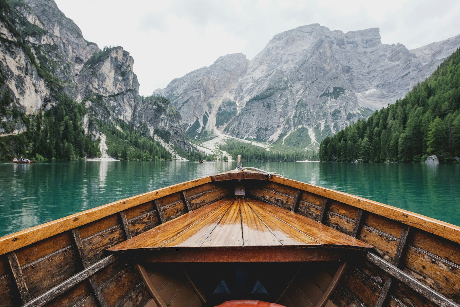 A boat on a still mountain lake